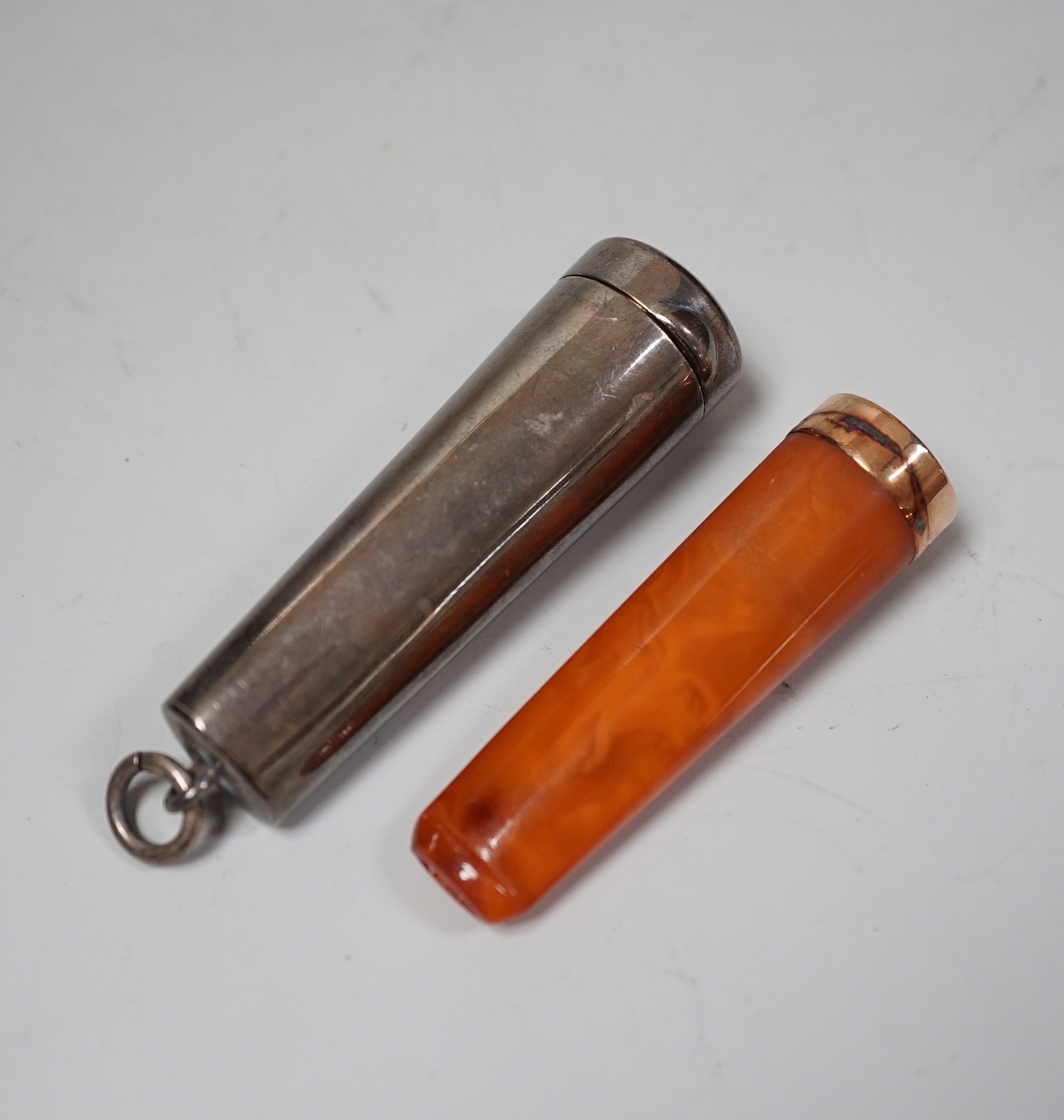 A late Victorian silver cheroot case, Chester, 1899, containing a similar 9ct gold mounted amber cigarette holder, outer case 65mm